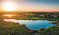 Aerial view above summer forest and lake at sunset, beautiful nature landscape panorama Royalty Free Stock Photo