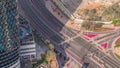 Aerial view from above to a busy road intersection in Dubai timelapse.