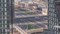 Aerial view from above to a busy road intersection in Dubai timelapse.