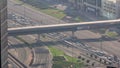 Aerial view from above to a busy road intersection in Dubai timelapse.