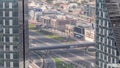 Aerial view from above to a busy road intersection in Dubai timelapse.