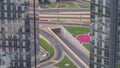 Aerial view from above to a busy road intersection in Dubai timelapse.