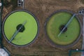 Aerial view above waste water treatment plant with green algae Royalty Free Stock Photo