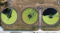 Aerial view above waste water treatment plant with green algae Royalty Free Stock Photo