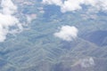 Aerial view of agricultural fields, river, mountains, and land have seen through the airplane window Royalty Free Stock Photo