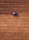 Aerial view of agricultural tractor doing stubble tillage Royalty Free Stock Photo