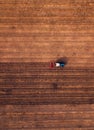 Aerial view of agricultural tractor doing stubble tillage