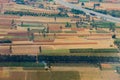 Aerial view of agriculture lands of Karnataka near Bangalore. Green and brown patches are seen from drone shot with roads passing Royalty Free Stock Photo