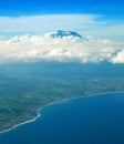 Aerial view from aiprlane on Bali seashore and Agung volcano. Indonesia Royalty Free Stock Photo