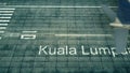 Aerial view of an airplane arriving to Kuala Lumpur airport. Travel to Malaysia 3D rendering