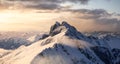 Aerial View from Airplane of Blue Snow Covered Canadian Mountain Landscape