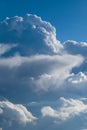 Aerial view from airplane of rain clouds and blue sky