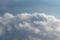 Aerial view from airplane of rain clouds and blue sky