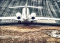 Aerial view of airplane ready to take off on airport runway Royalty Free Stock Photo