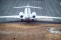 Aerial view of airplane ready to take off on airport runway Royalty Free Stock Photo