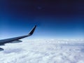 Aerial View from the Airplane Window Airplane Wing and Clouds blue sky freedom travel Royalty Free Stock Photo