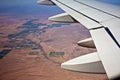 Aerial View of Airplane Wing Over Land