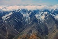 Aerial View of Alpine Glaciers Cut in Remote Mountains Royalty Free Stock Photo