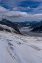 Aerial view of the Alps mountains in Switzerland. View from helicopter in Swiss Alps. Mountain tops in snow. Royalty Free Stock Photo