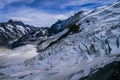 Aerial view of the Alps mountains in Switzerland. View from helicopter in Swiss Alps. Mountain tops in snow. Royalty Free Stock Photo