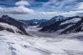 Aerial view of the Alps mountains in Switzerland. View from helicopter in Swiss Alps. Mountain tops in snow. Royalty Free Stock Photo