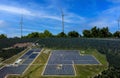 The aerial view Alternative clean energy while the solar panel, solar -with wind turbines generating electricity Royalty Free Stock Photo