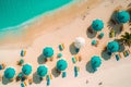 Aerial view of amazing beach with umbrellas and lounge chairs beds close to turquoise sea. Top view of summer beach landscape,