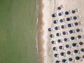 Aerial view of an amazing empty sand beach with straw beach umbrellas and turquoise clear water. Bulgaria Black Sea Royalty Free Stock Photo