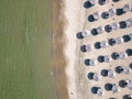 Aerial view of an amazing empty sand beach with straw beach umbrellas and turquoise clear water. Bulgaria Black Sea Royalty Free Stock Photo