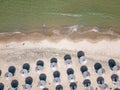 Aerial view of an amazing empty sand beach with straw beach umbrellas and turquoise clear water. Bulgaria Black Sea Royalty Free Stock Photo