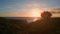 Aerial view amazing evening seascape grassy hills shore. Water rippling surface