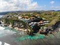 Aerial view of an amazing little surfer village on the rock cliff and coastline. Royalty Free Stock Photo