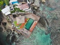 Aerial view of an amazing little surfer village on the rock cliff and coastline. Royalty Free Stock Photo