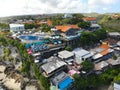 Aerial view of an amazing little surfer village on the rock cliff and coastline. Royalty Free Stock Photo