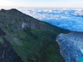 Aerial view Amazing of Mountains rock cliff at Kawah Ijen volcano with fog at sunrise.Amazing nature landscape view at East Java,