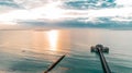 Aerial view of an amazing pier with a small pavilion in Tanzania at sunset Royalty Free Stock Photo