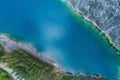 Aerial view of amazing pond in tropical rainforest forest with mountain rocks peak Beautiful water surface in Phang Nga Thailand