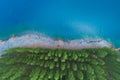 Aerial view of amazing pond in tropical rainforest forest with row of pine trees Beautiful water surface in Phang Nga Thailand Royalty Free Stock Photo