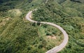 Aerial view of amazing road with green forest and mountain,Bird\'s eye view from drone