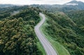 Aerial view of amazing road with green forest and mountain,Bird\'s eye view from drone