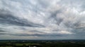 Aerial view amazing sunset over of the suburbs with the city under dramatic rain cloud. Global warming effect black Royalty Free Stock Photo