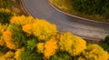 Aerial view of an amazing winding curved road through the mountains in autumn fall colors landscape, motorway in Romania Royalty Free Stock Photo