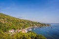 Aerial view of Amed beach in Bali, Indonesia. Traditional fishing boats called jukung on the black sand beach and Mount Royalty Free Stock Photo