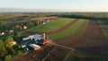 Aerial view of american countryside landscape. Farm, red barn, cows. Rural scenery, farmland. Sunny morning, spring summer season Royalty Free Stock Photo