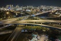 Aerial view of american highway junction at night with fast driving vehicles in Miami, Florida. View from above of USA