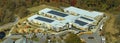 Aerial view of american school building with rooftop covered with photovoltaic solar panels for production of electric Royalty Free Stock Photo