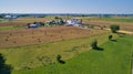 Aerial View of Amish Farm Harvest Rolled Crops ready for Storage on a Sunny Day as Seen by a Drone