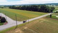 Amish Farm Land and a Horse and Buggy Going Down the Road Royalty Free Stock Photo