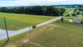 Amish Farm Land and a Horse and Buggy Going Down the Road Royalty Free Stock Photo