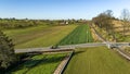 Aerial View of an Amish Horse and Buggy Traveling a Country Road Approaching a Rail Road Crossing Royalty Free Stock Photo